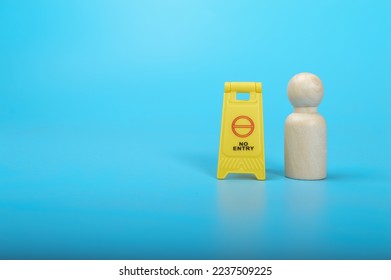 Wooden doll figure and No Entry sign. - Shutterstock ID 2237509225