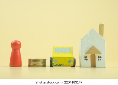 Wooden Doll People, Car, Stack Coin With House. Property Investment, Saving For The Future And Building A House. The Concept Of Affordable Housing And Car, Mortgages For Buying A Home Or Car.