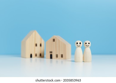 Wooden Doll People Human With House, Couple Relationship Symbol. Insurance And Property Investment, Saving For The Future And Building A House, Family For Future Concept.