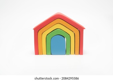 Wooden Dollhouse Models In Rainbow Colors.