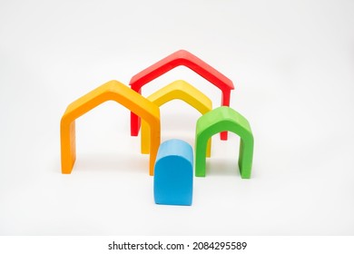 Wooden Dollhouse Models In Rainbow Colors.