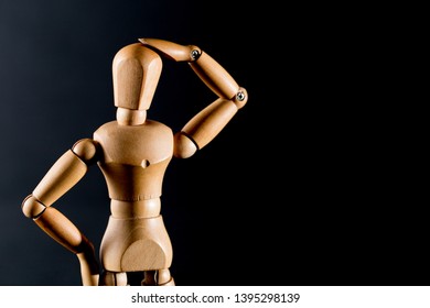 Wooden dolls in black background - Powered by Shutterstock