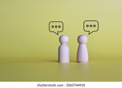 Wooden dolls with speech bubble of message and chatting on yellow background with copy space. Social media interaction and chat concept. - Shutterstock ID 2065744910