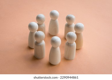 Wooden dolls standing in a circle facing each other. Team decision or working together concept. - Shutterstock ID 2290944861