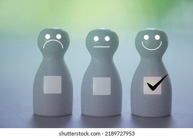 The Wooden Dolls With A Various Face Icons Happy And Angry A Choosing A Smile Icon From Customer To Satisfaction Receive. Impressive Shopping Or Service A Great Experience.