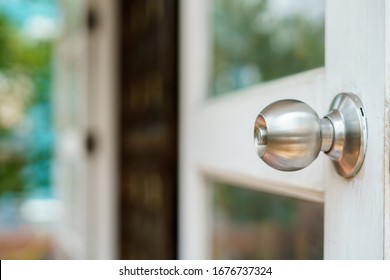 	
Wooden Door With Grill, Stainless Door Knob Or Handle On Wooden Door In Beautiful Lighting