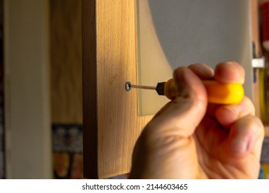 The Wooden Door Repair.Screw The Screw Into The Door.