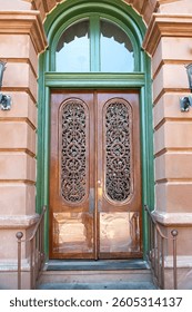 wooden door in the stone wall of a house with a porch.