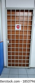 Wooden Door With White Metal Grill