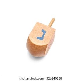 Wooden Dreidel For Hanukkah On White Background