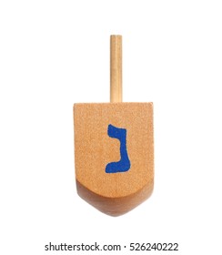 Wooden Dreidel For Hanukkah On White Background
