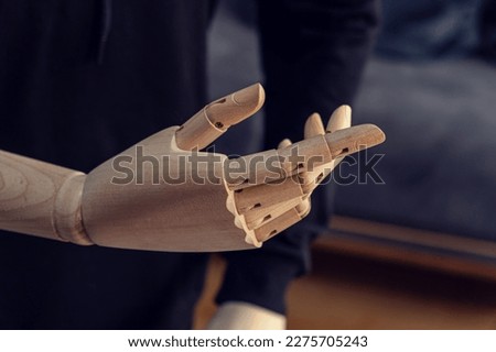 Wooden dummy hand. Telling gesture. Good talk. indirect explanat