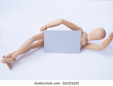 wooden dummy holding empty white blank card for your text - Powered by Shutterstock