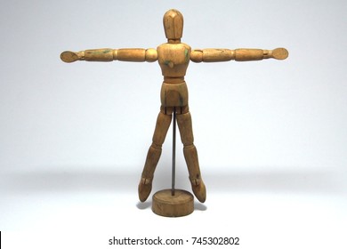 Wooden dummy isolated on a white background - Shutterstock ID 745302802