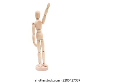 Wooden Dummy Man Waving Hello. Classic Wooden Mannequin In Demonstration Pose, Standing Against Isolated White Background. Demonstration Of Product, Information, Text.