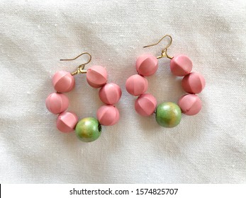 Wooden earrings DIY workshop handmade jewelry crafted work pastel green pink color clean hand craft by artisan - Powered by Shutterstock