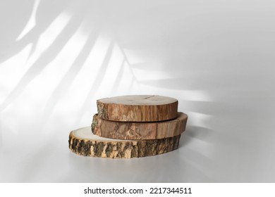 Wooden Eco Rustic Pine Tree Circle Disc Platform Podium On Light And Shadow Background. Minimal Empty Display Product Presentation Scene.