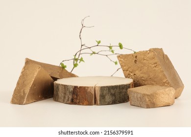 Wooden eco rustic wood circle disc platform podium and gold stones on beige background. Minimal empty display product presentation scene. - Shutterstock ID 2156379591