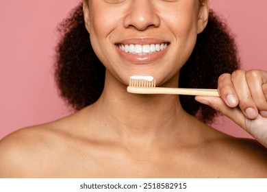 Wooden eco toothbrush, dental care and sustainability against pink background. A tranquil daily self-care routine. Beauty and wellness concept. Dental care concept. - Powered by Shutterstock