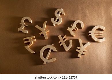 Wooden economy and currency unit on a craft background