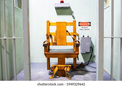 Wooden electric chair for death sentence in prison cell concept