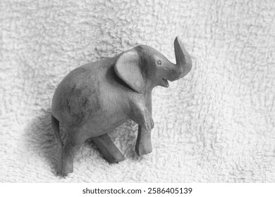 The wooden elephant toy had one leg broken