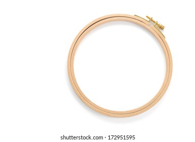 Wooden embroidery hoop isolated on white background.