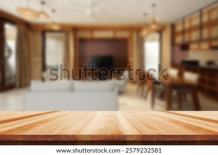 Wooden empty table in front of blured background Living room sofa interior.