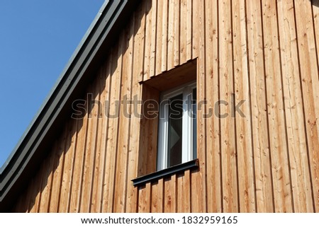 
Wooden facade of a detached house with window, Germany