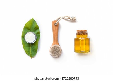 Wooden Face Brush, Cosmetic Oil And Handmade Cream. Eco-friendly Spa, Massage, Peeling And Hydration Products. White Background, Top View, Flat Lay, Copy Space.