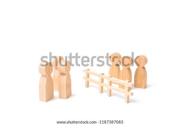 A wooden fence divides the two groups
discussing the case. Termination and breakdown of relations,
breaking ties. Contract break, conflict of interests. Negotiations
of businessmen.