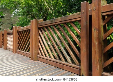 Wooden Fence In Garden With Tree