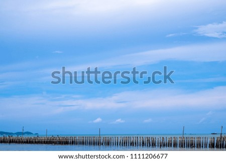 Similar – wooden platform with blue posts with ropes and orange lifebuoys on the background of the sea and sky with clouds Egypt Dahab South Sinai