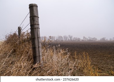 The wooden fence post as the fog starts to lift.  - Powered by Shutterstock