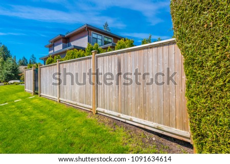 Wooden fence. Separate and protect private property.