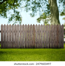 Wooden fence, tree and green grass outdoors - Powered by Shutterstock