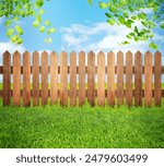 Wooden fence, trees and green grass outdoors