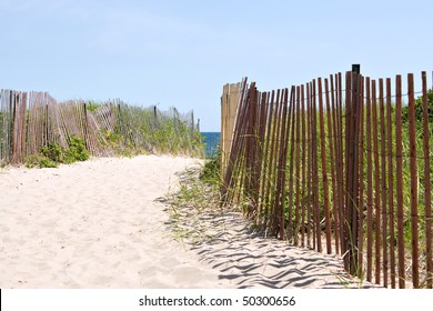 Wooden Fences Lining The Entrance To The Rhode Island Beach.