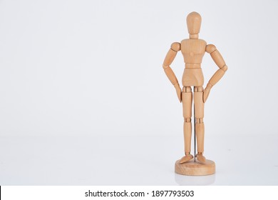 Wooden figure  a man of white background.  - Powered by Shutterstock