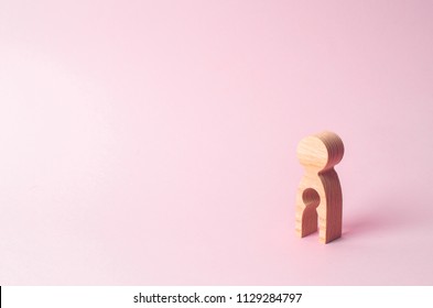 A wooden figure of a woman with a void inside in the shape of a child. The concept of the loss of child, abortion of pregnancy, miscarriage. Infertility in women. unhappy mother lost her child
