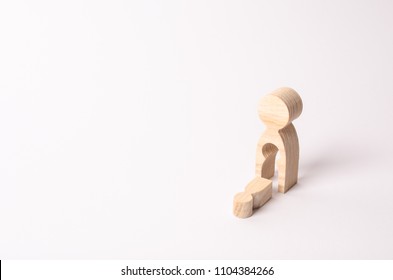 A Wooden Figure Of A Woman With A Void From Which A Child Fell. The Concept Of The Loss Of A Child, Abortion Of Pregnancy, Miscarriage. Mother Lost Her Child. Deprivation Of Parental Rights.