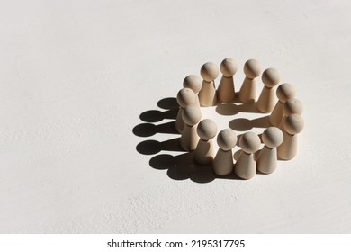 Wooden Figures Forming Circle Of Teamwork. Concept Of Leadership, Business, And Challenge