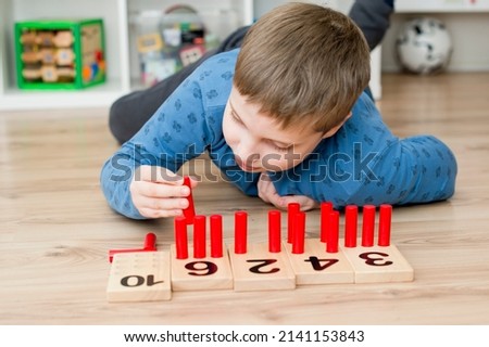 Wooden figures of the Montessori methodology. Math kids counting puzzle for kids. Educational training in computing games to develop. An intelligent children's math toy. Number game board.