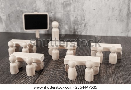 Wooden figures peg dolls stand above wooden cube among others with vote yes or no symbol. Open-mindedness or public hearing, concept of elections. Volunteers, candidates, constituency electorates.
