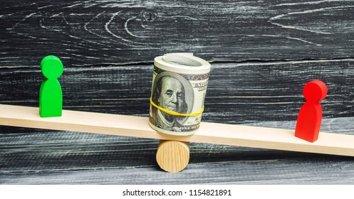 Wooden Figures Of People On Scales And Dollars Between Them. A Dispute Between Two Businessmen. Trial. Debt Restructuring. Wage Arrears. Protection Of Employee Rights. Court. Labor Law