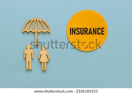 Wooden figures of people under an umbrella, Insurance text on a beautiful yellow circle that looks like the sun shining, Blue background,  Insurance concept, Health and life property protection