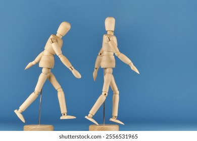 Wooden figures representing a morning walk for couples to exercise the body - Powered by Shutterstock