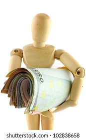 A Wooden Figurine Doll Holding A Roll Of Euro Money Paper Currency Tightly Isolated On White Background