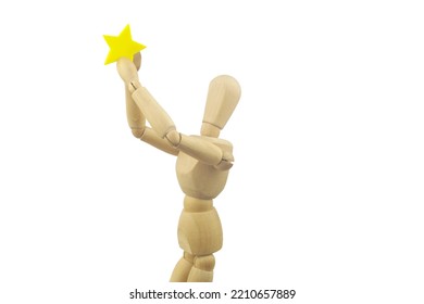 Wooden Figurine Holding Yellow Star Isolated On White Background. Superstar Or Celebrity Concept.