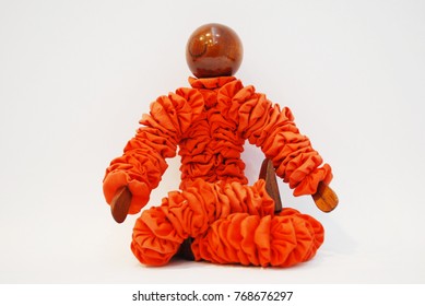 Wooden figurine sitting in a lotus position - Powered by Shutterstock